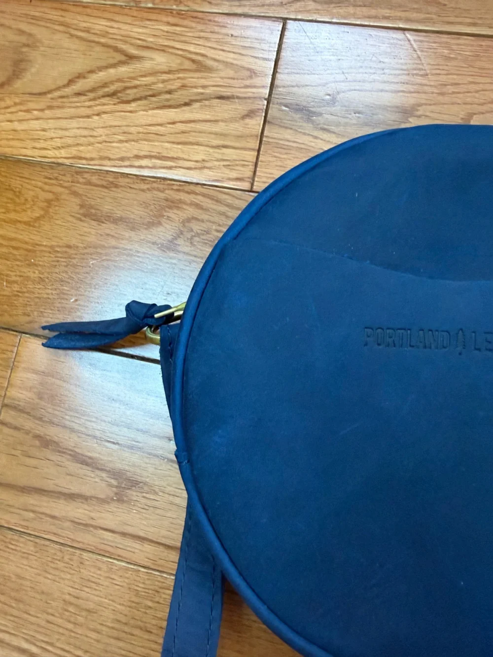 Portland Leather Nubuck Leather Small Round Crossbody Bag